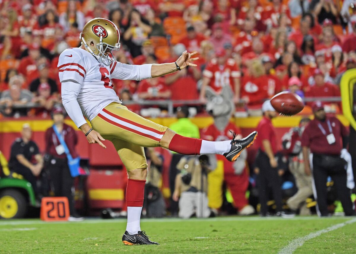 The 49ers' Mitch Wishnowsky punts the ball during a preseason game against the Chiefs on Aug. 24, 2019.