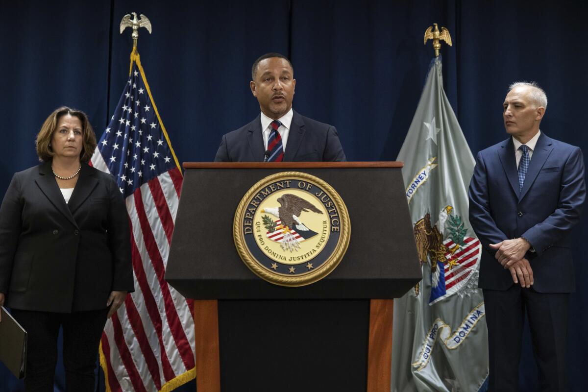 U.S. Atty. for the Eastern District of New York Breon Peace, center, speaks during a press conference.