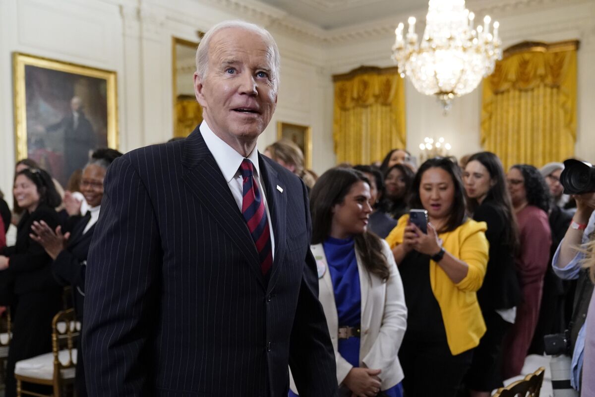 President Joe Biden departs after speaking an event to celebrate Equal Pay Day and Women's History Month in the East Room of the White House, Tuesday, March 15, 2022, in Washington. (AP Photo/Patrick Semansky)