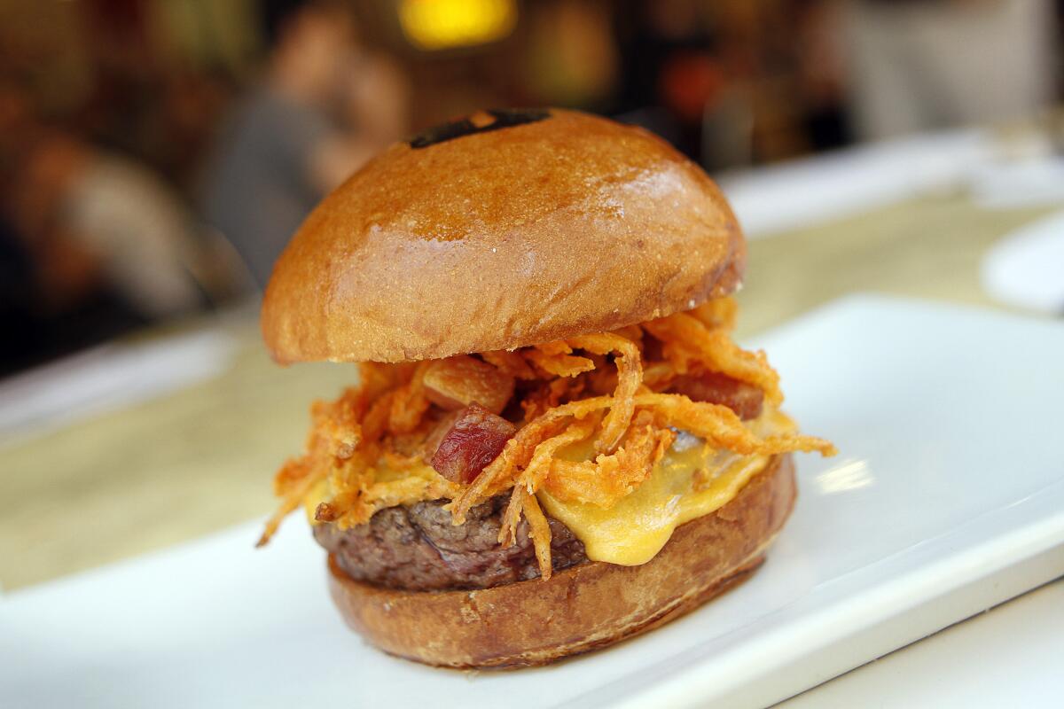 Try the "manly burger" with cheese and onions from Umami, just one of 40 restaurants participating in the Jan. 10-15 Pasadena Cheeseburger Week.