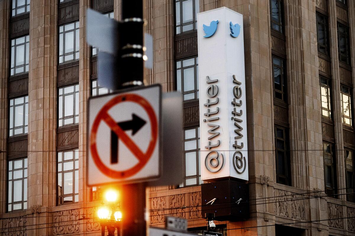 A sign hangs at Twitter headquarters in San Francisco. 