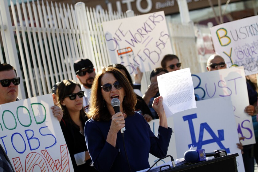 Madeline Janis, director of the Jobs to Move America coalition, speaks outside the BYD headquarters in Los Angeles on Tuesday.