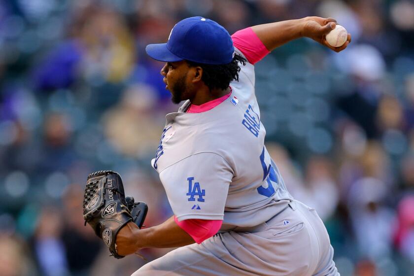 Dodgers reliever Pedro Baez delivers a pitch during a game May 10 against the Colorado Rockies at Coors Field in Denver.