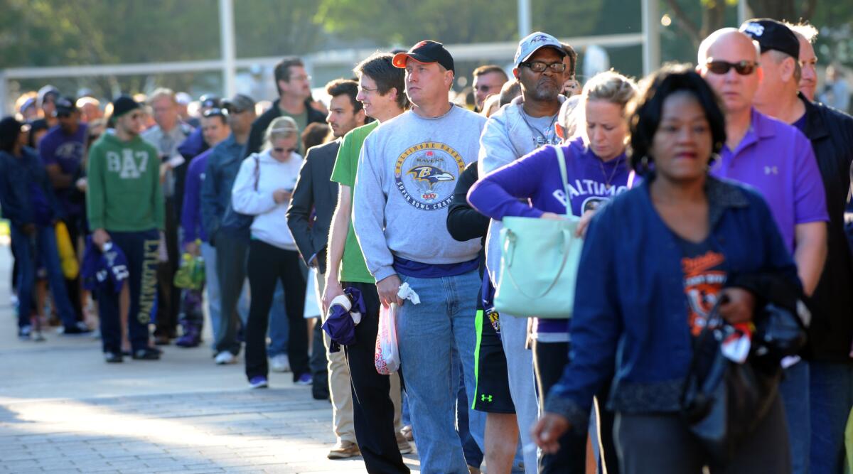 Ravens fans line up to exchange their Ray Rice jerseys Friday at M&T Bank Stadium.