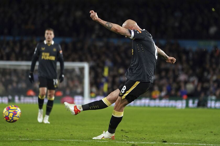 Newcastle United's Jonjo Shelvey scores the opening goal during the English Premier League soccer match between Leeds United and Newcastle at Elland Road, Leeds, England, Saturday, Jan. 22, 2022. (Mike Egerton/PA via AP)