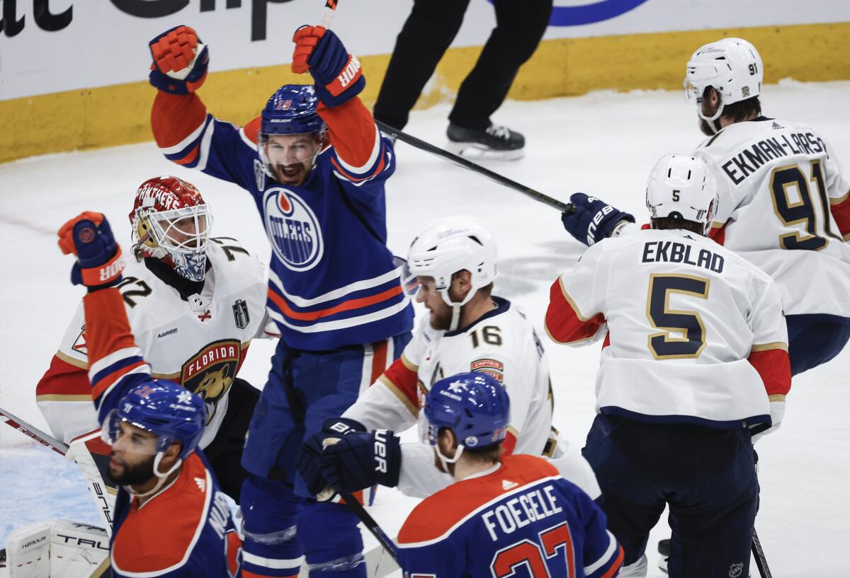 Edmonton Oilers forward Zach Hyman, top right, celebrates a goal against the Florida Panthers.