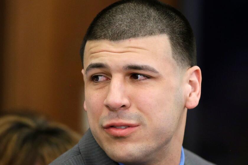 FILE - In this April 14, 2017 file photo, former New England Patriots tight end Aaron Hernandez reacts to his double murder acquittal after the sixth day of jury deliberations at Suffolk Superior Court in Boston. Hernandez's lawyer said Thursday, Sept. 21, 2017, the former New England Patriots tight end's brain showed severe signs of the degenerative brain disease chronic traumatic encephalopathy. (AP Photo/Stephan Savoia, Pool, File)