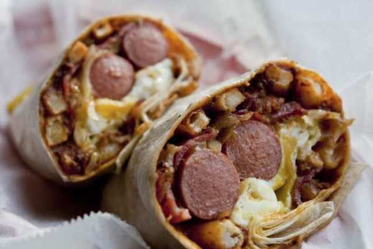 The U.S.A.: Still the greatest! This TNT Superdog from the Slaw Dogs in Pasadena blows away Pizza Hut's new hot-dog-stuffed-crust pizza that people in Britain can now enjoy.