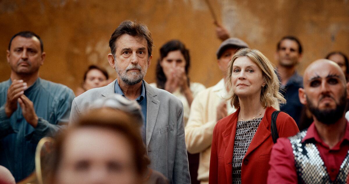 a man and a woman in a crowd