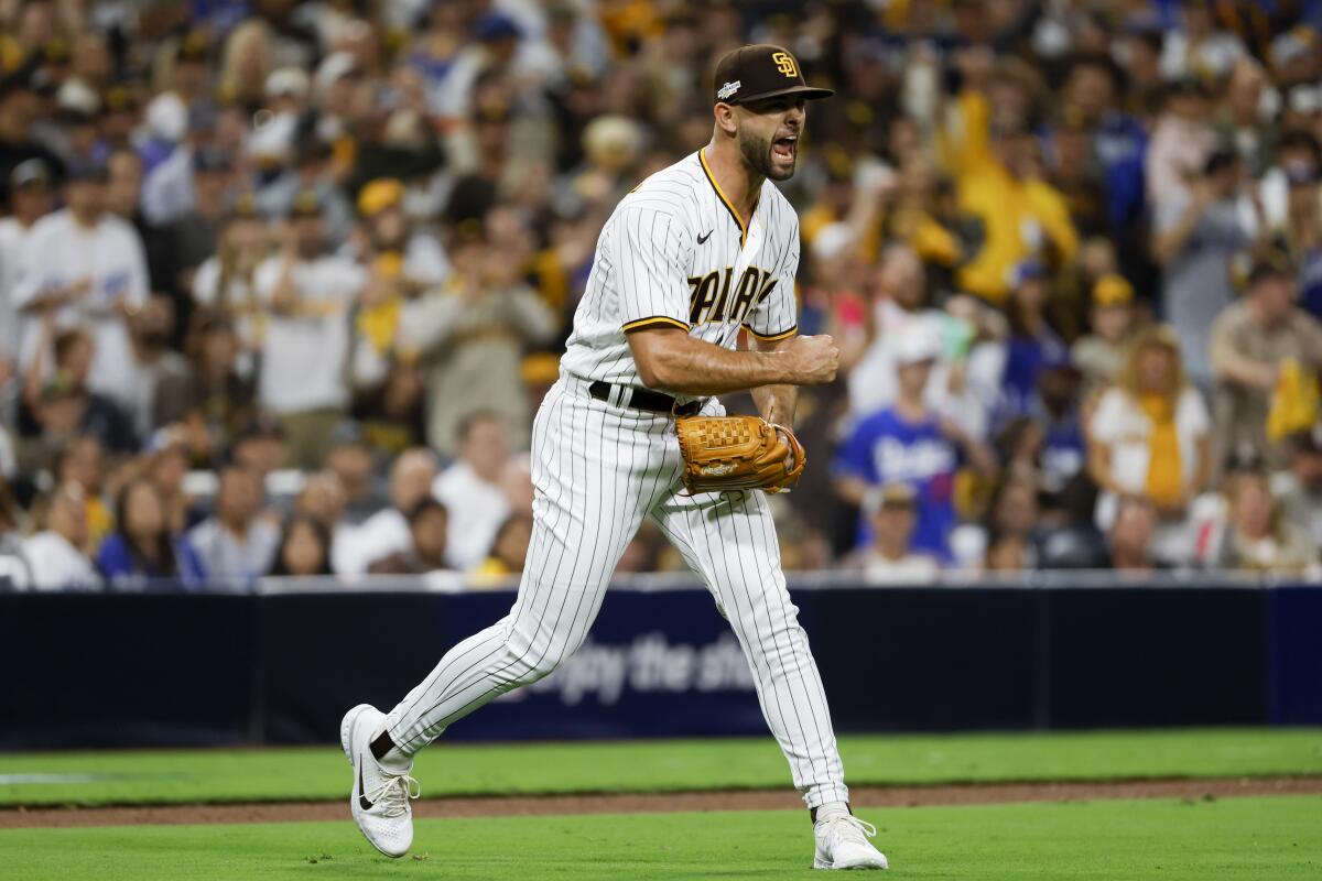 San Diego Padres relief pitcher Nick Martinez, right, celebrates