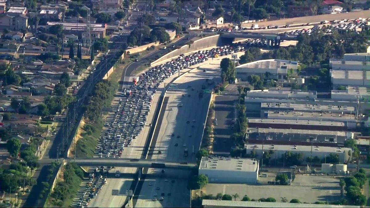The 110 in Gardena is jammed with traffic after being shut down following reports of a shooting.