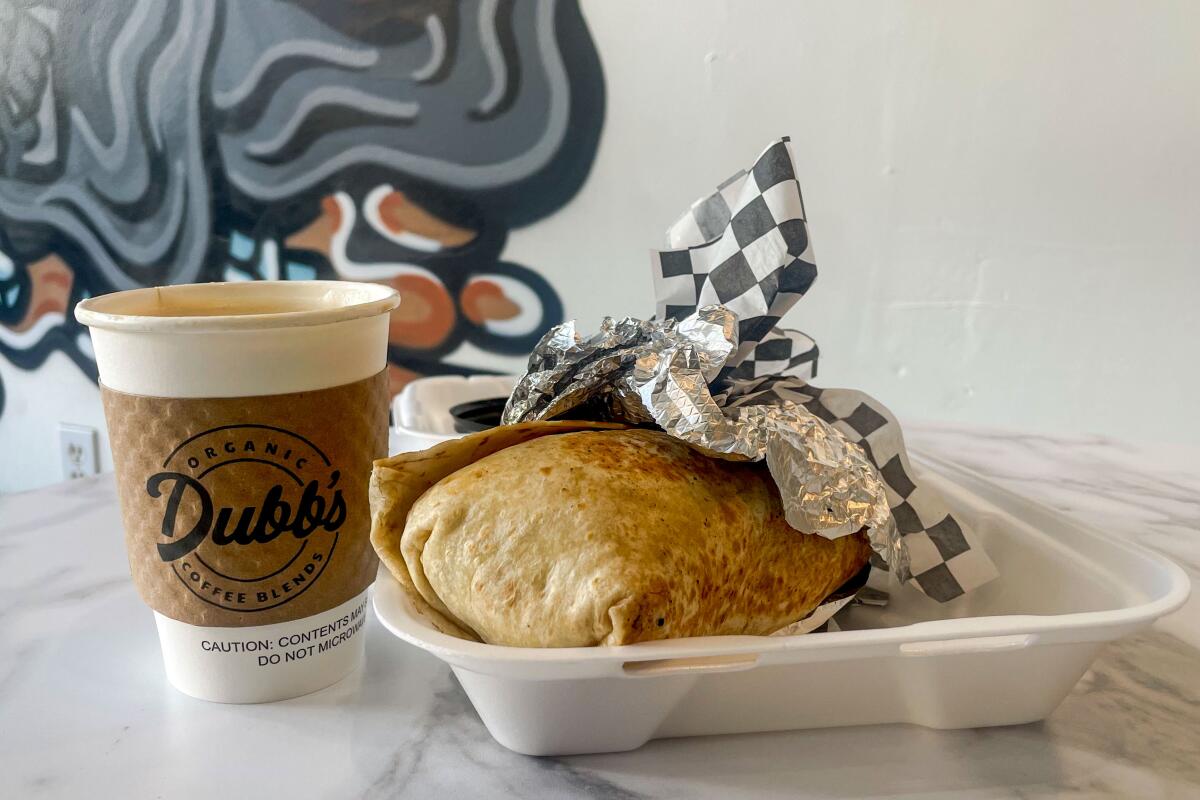 A photograph of a coffee and breakfast burrito from Dubbs.