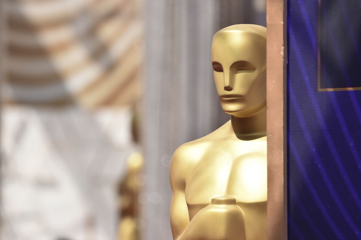 FILE - Oscar statue on the red carpet at the Oscars on Sunday, March 27, 2022, at the Dolby Theatre in Los Angeles. Next year's Academy Awards will take place March 13, 2023, the Academy of Motion Pictures Arts and Sciences announced Friday, May 13. (Photo by Jordan Strauss/Invision/AP, File)