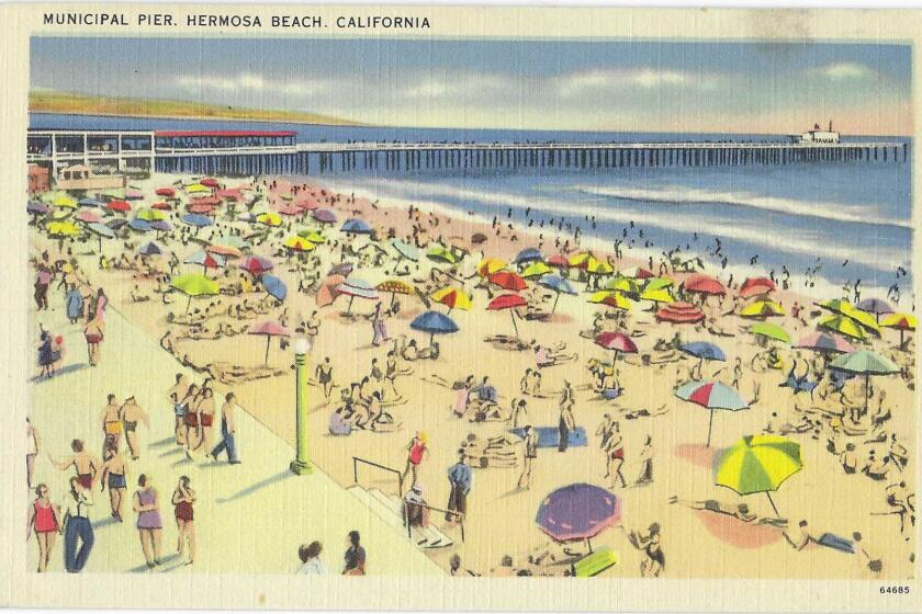 Sunbathers on the sand, people on the Strand, and the Hermosa Beach pier