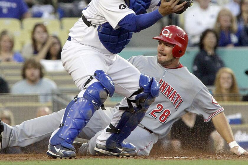 Chris Heisey scores for the Cincinnati Reds back in 2011.