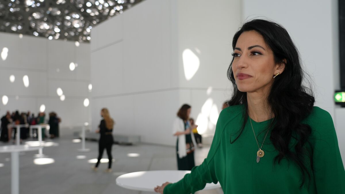 Huma Abedin poses for a picture at the Forbes 30/50 event in the Louvre Museum in Abu Dhabi, Monday, March 7, 2022. Abedin is telling her story in a 500-page memoir titled: “Both/And: A Life in Many Worlds” that she brought to the capital of the United Arab Emirates. For more than two decades, Abedin has been the ever-loyal aide to Hillary Clinton and the betrayed wife of of Anthony Weiner. She appears comfortable now stepping out into the spotlight, even if it means confronting the judgement and shame she’s faced over her marriage to former New York Congressman Anthony Weiner, whose confiscated laptop roiled Clinton’s 2016 presidential campaign. (AP Photo/Malak Harb)