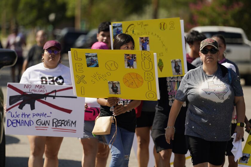 Family member and friends of those killed and injured in the school shooting at Robb Elementary prepare to march, Sunday, July 10, 2022, in Uvalde, Texas. (AP Photo/Eric Gay)