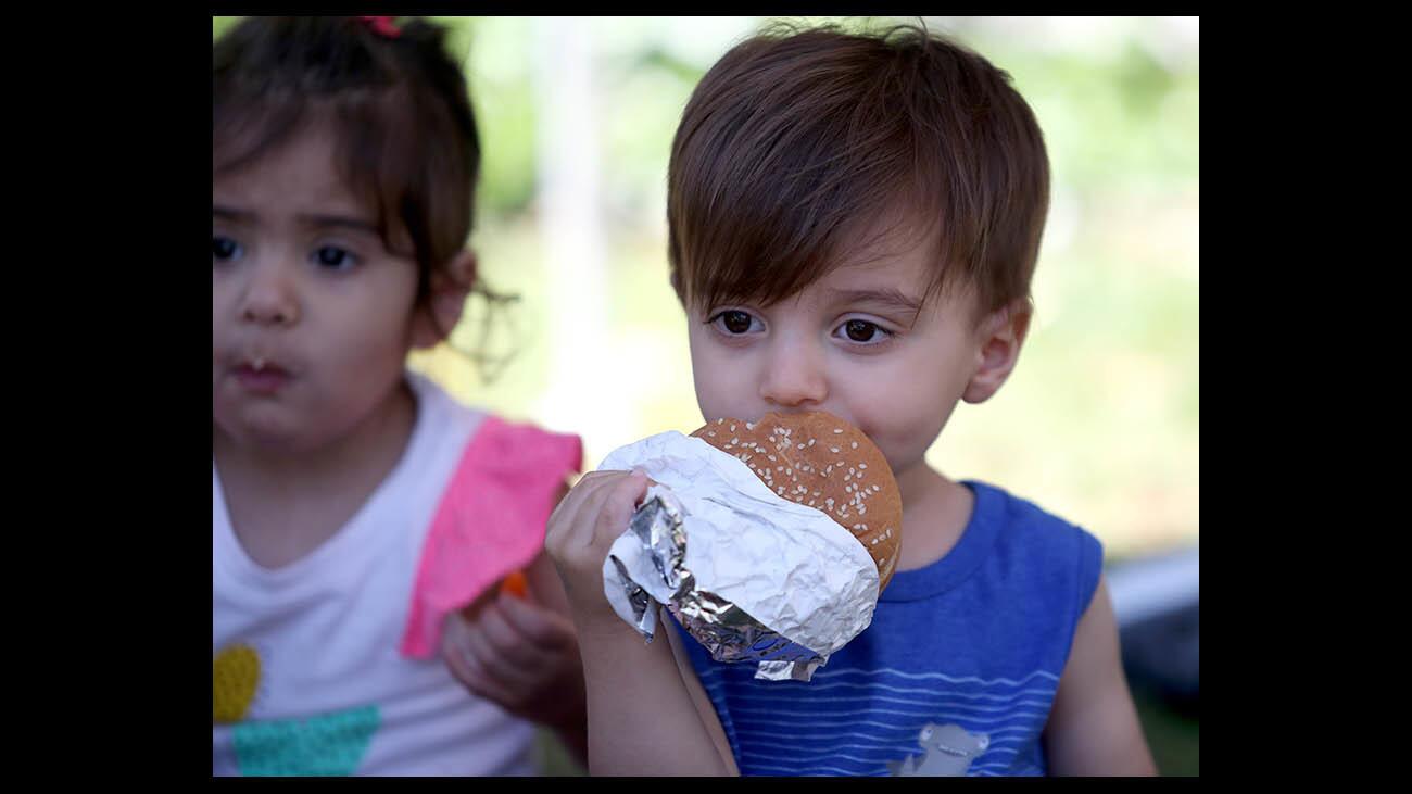 Alexander Hovsepian, 2, enjoys a chicken sandwich for lunch at the Glendale Central Library on Tuesday, June 12, 2018. Anyone age 18 and under can receive a free lunch through the Lunch at the Library summer program.