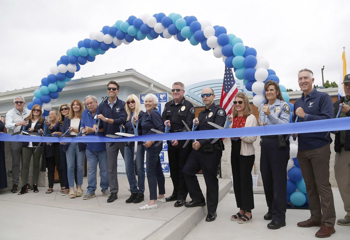 City officials and dignitaries stand outside the Newport Beach Animal Shelter.