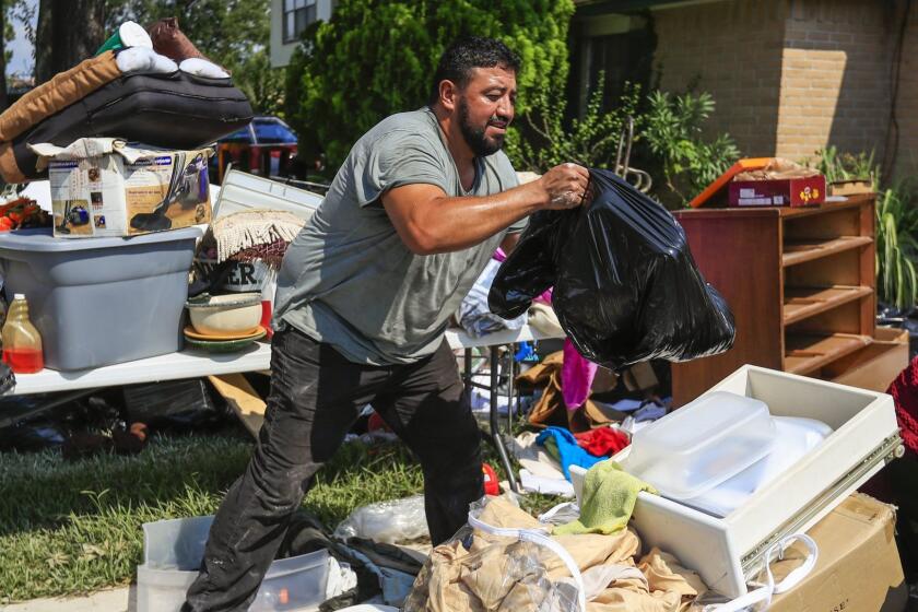 epa06178271 Humberto Romero removes damaged items from his flooded home as he begins to clean up in the aftermath of Hurricane Harvey in Houston, Texas, USA, 01 September 2017. Hurricane Harvey made landfall on the south coast of Texas as a major hurricane category 4. The last time a major hurricane of this size hit the United States was in 2005. EPA/TANNEN MAURY ** Usable by LA, CT and MoD ONLY **