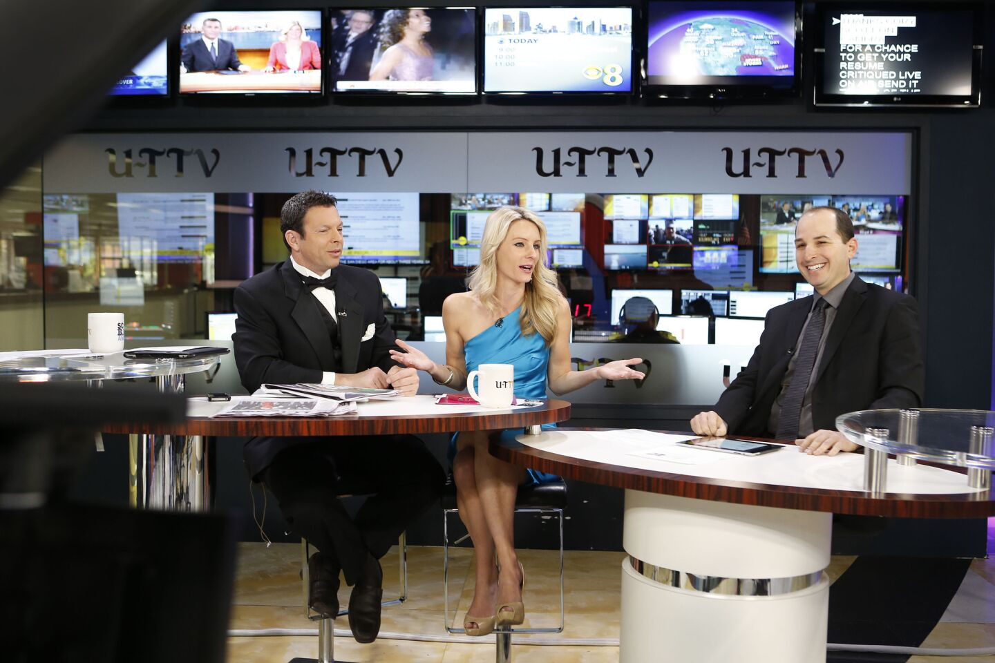 Scott Kaplan (left) and Amber Mesker, the hosts of “Front Page with Scott & Amber,” on the set of U-T TV with Cory Fish, right, then human resources manager for the newspaper. His appearances were a regular segment.