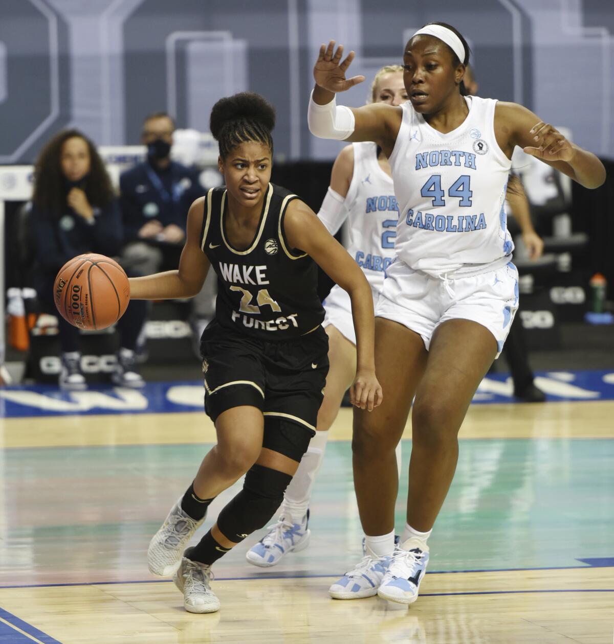 Wake Forest's Jewel Spear drives the baseline past North Carolina's Janelle Bailey during an NCAA college basketball game in the Atlantic Coast Conference tournament, Thursday, March 4, 2021, at the Greensboro Coliseum in Greensboro, N.C. (Walt Unks/The Winston-Salem Journal via AP)