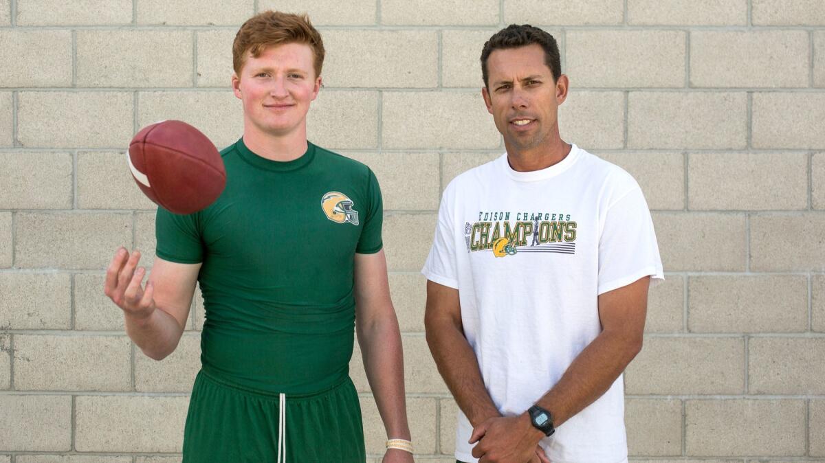 Edison High coach Jeff Grady, right, and quarterback Griffin O'Connor are looking forward to the season ahead of them. The Chargers are coming off a 2016 campaign in which they won the CIF Southern Section Division 3 championship.