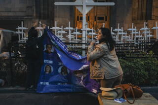 Supporters put up posters in the main square