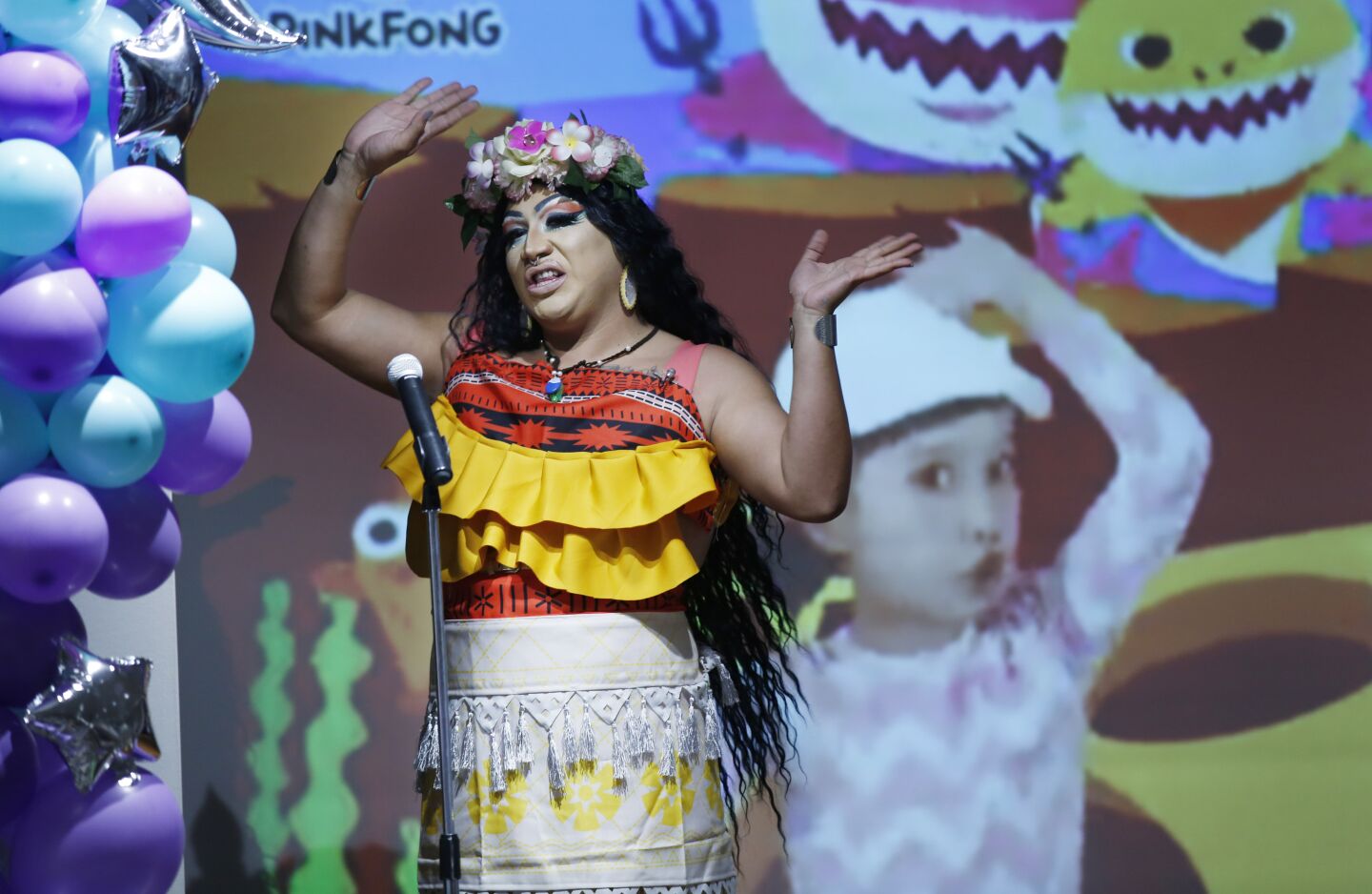 Barbie_Q, a drag queen, sings the song Baby Shark during Drag Queen Story Time at the Chula Vista Civic Center Library on Sept. 10, 2019.