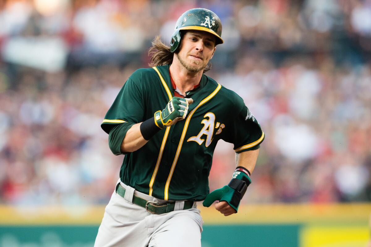 Josh Reddick rounds second for Oakland against Cleveland on July 30.