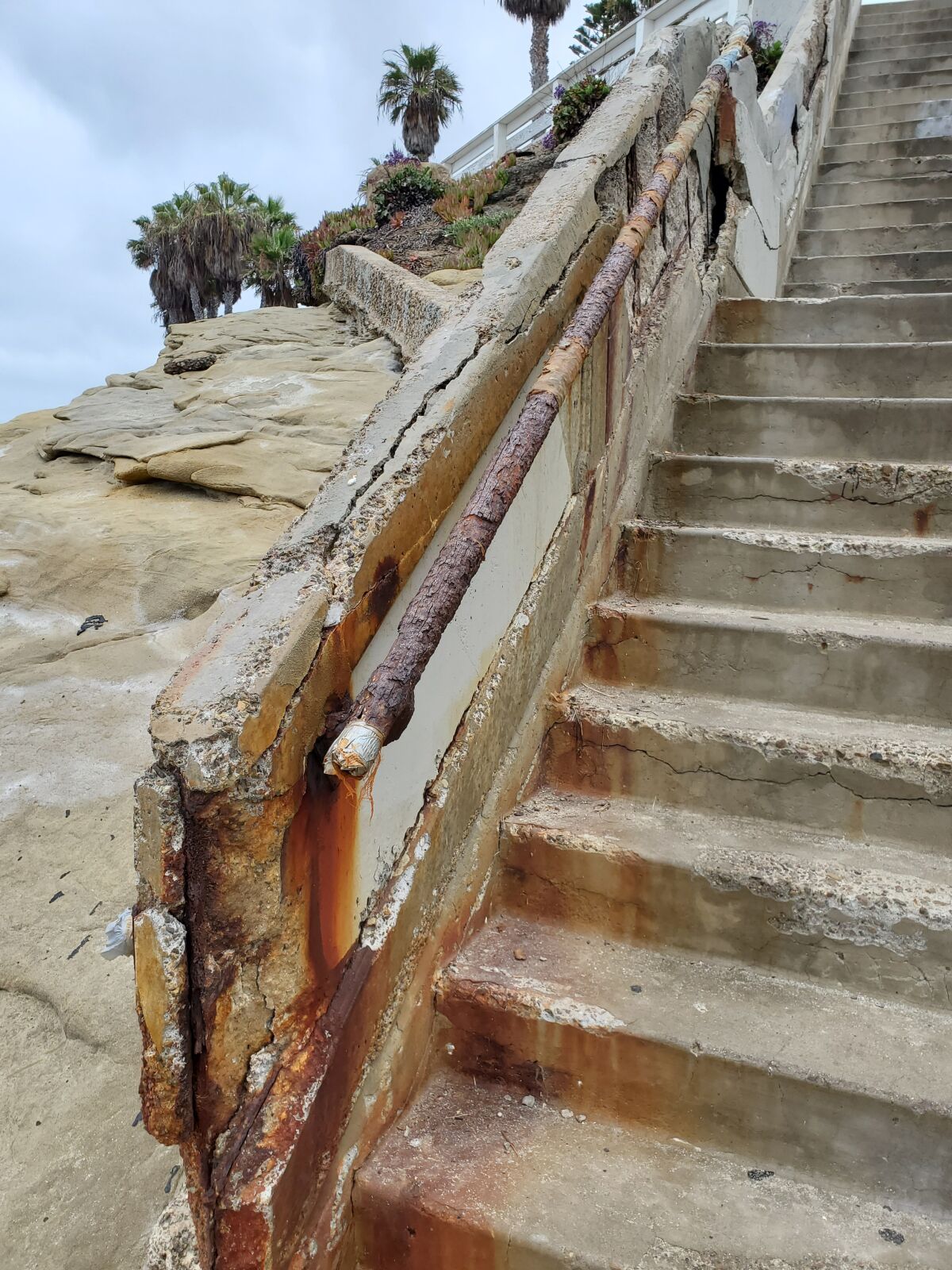 Rusted rebar and crumbling concrete plague the oceanside stairway from Camino de la Costa in La Jolla.