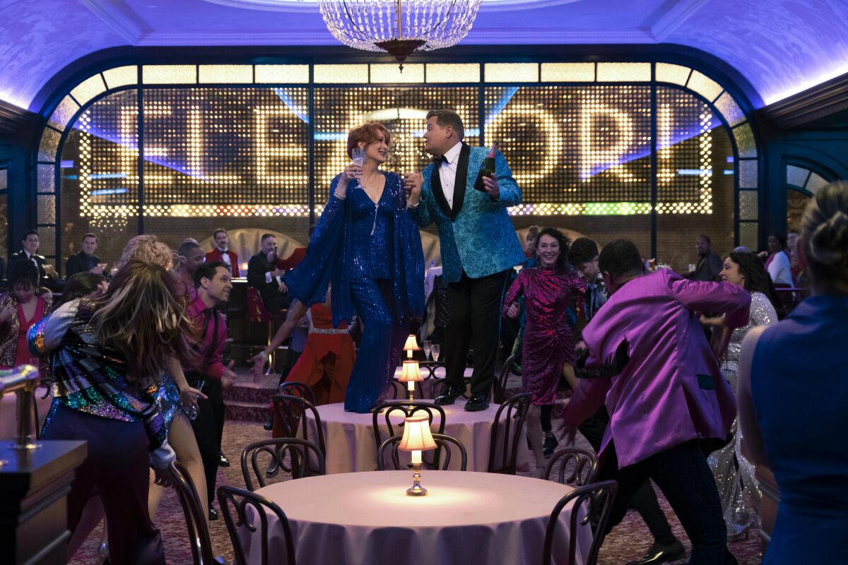 This image released by Netflix shows, Meryl Streep, center left, and James Corden in a scene from "The Prom." (Melinda Sue Gordon/Netflix via AP)