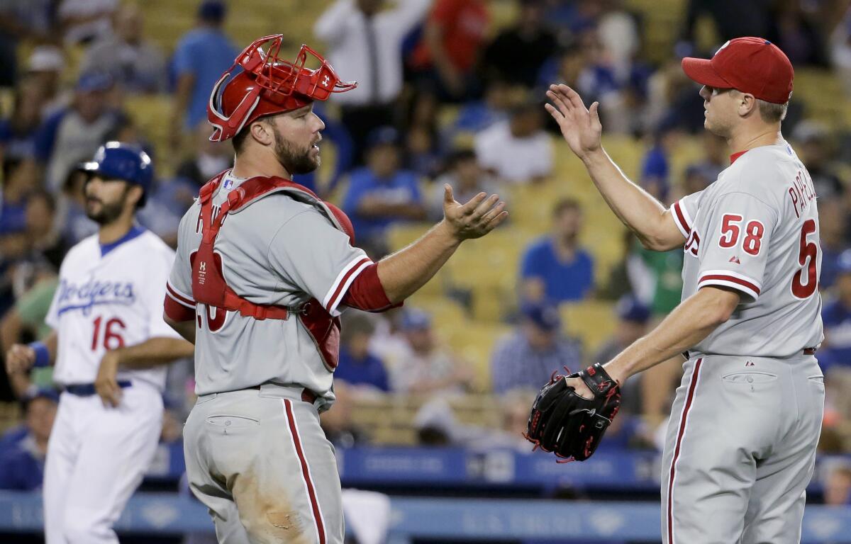 Phillies relief pitcher Jonathan Papelbon celebrates with catcher Cameron Rupp, right, after Philadelphia's 7-2 win over the Dodgers on Tuesday at Dodger Stadium.