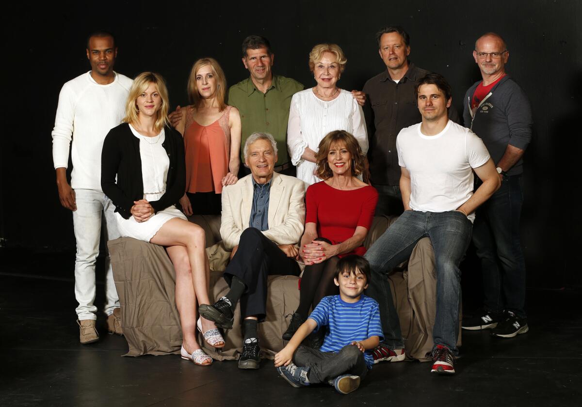 "The City of Conversation": Sitting, from left, Georgia King, David Selby, Christine Lahti, Nicholas Oteri (on ground) and Jason Ritter; standing, Johnny Ramey, Deborah Offner, playwright Anthony Giardina, Michael Learned, Steven Culp and director Michael Wilson. (Mel Melcon / Los Angeles Time)