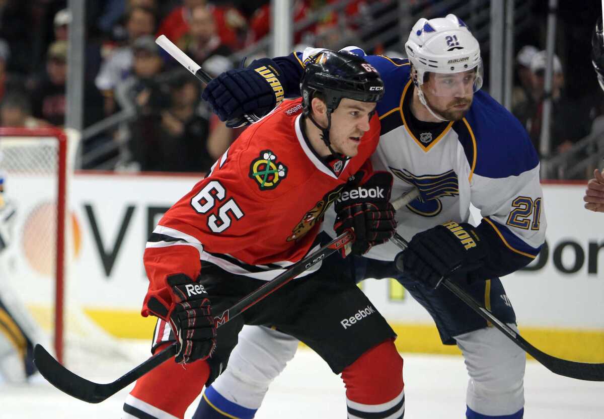 Chicago Blackhawks center Andrew Shaw battles with St. Louis Blues center Patrik Berglund during Game 3 of their first-round Stanley Cup playoff series on April 21.