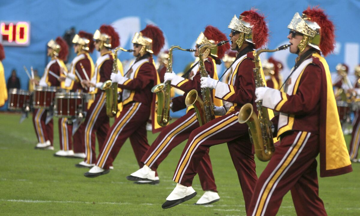 The USC Trojan Marching Band performs on the field during the opening ceremony of the 2019 Holiday Bowl 
