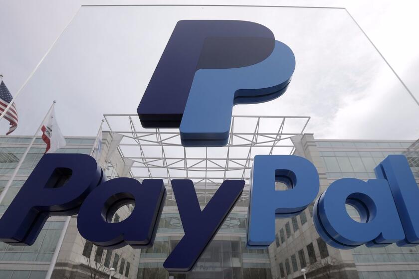This March 10, 2015 photo shows signage outside PayPal's headquarters in San Jose, Calif. When eBay and PayPal split up on Friday, July 17, 2015, they'll face different challenges than they did as a combined company. (AP Photo/Jeff Chiu)