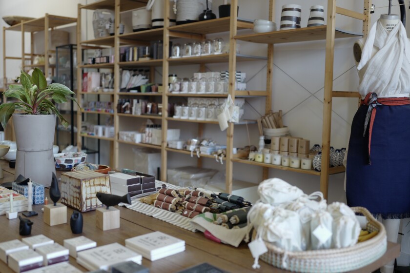 Shelves packed with candles and gifts at The Give Store in Hollywood.