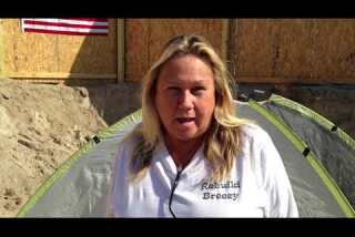 Sandy victim camps out where home once stood