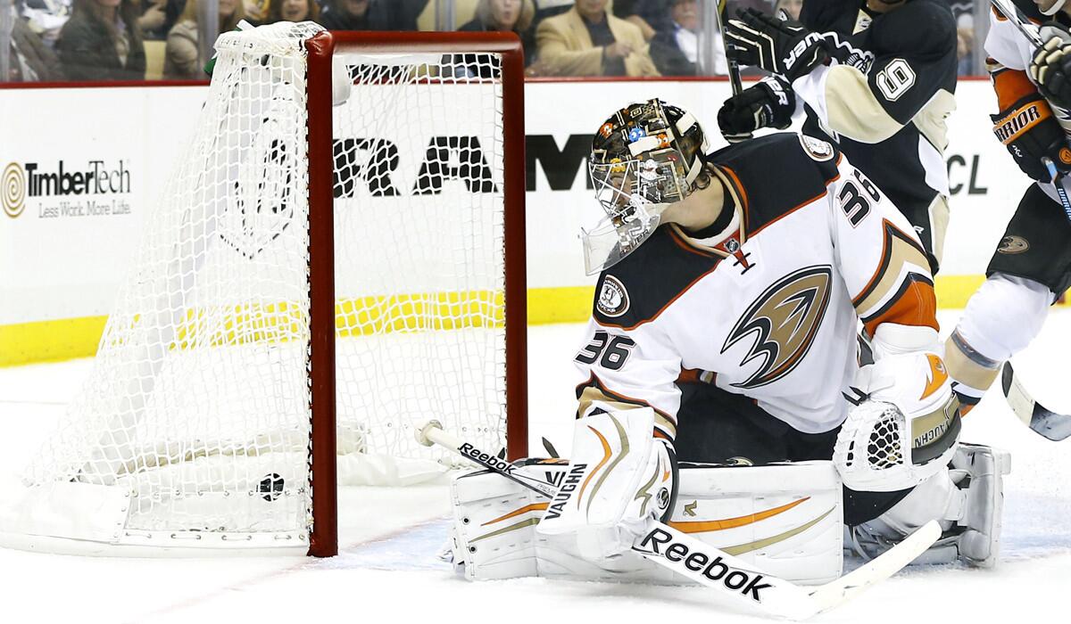 Ducks goalie John Gibson looks back to find a shot by the Penguins has gone into the goal during the second period Thursday night in Pittsburgh.
