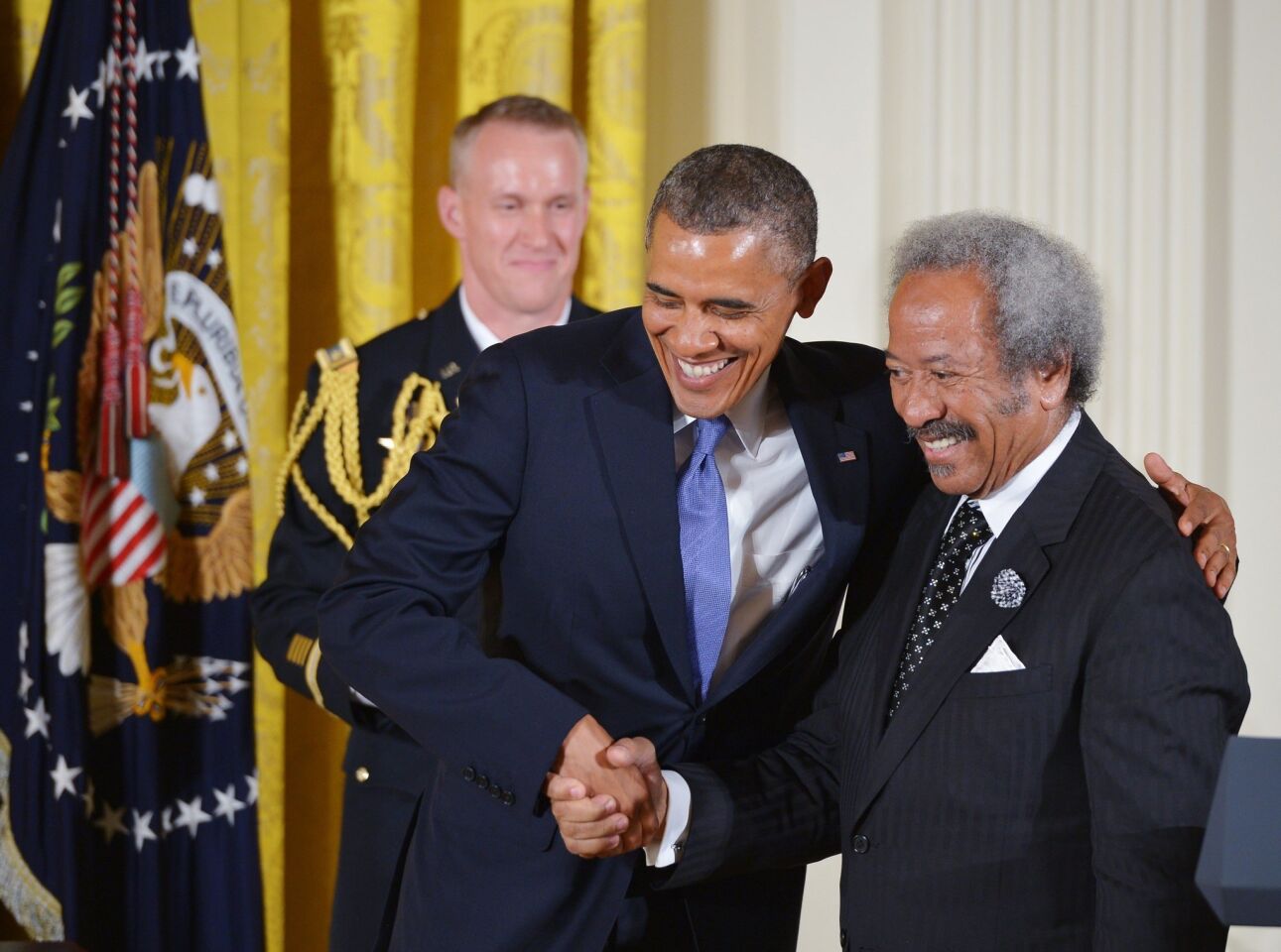 President Obama greets Allen Toussaint in the East Room of the White House in July 2013 during a ceremony to award the 2012 National Medal of Arts.