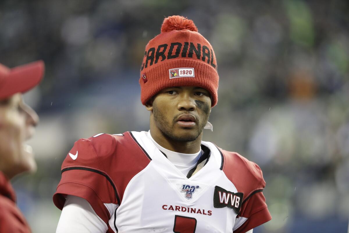 Arizona Cardinals starting quarterback Kyler Murray stands on the sideline 