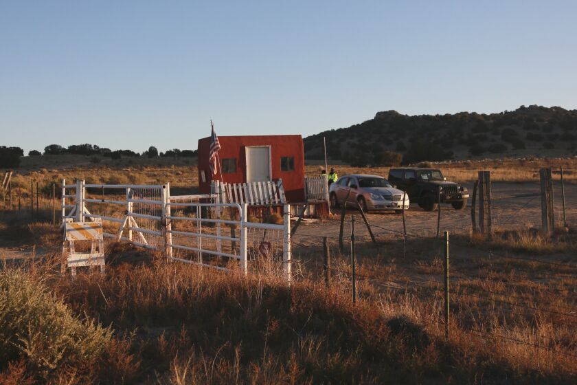 The entrance to a film set where police say actor Alec Baldwin fired a prop gun, killing a cinematographer, is seen outside Santa Fe, New Mexico, Friday, Oct. 22, 2021. The Bonanza Creek Ranch film set has permanent structures for background used in Westerns, including "Rust," the film Baldwin was working on when the prop gun discharged. (AP Photo/Cedar Attanasio)