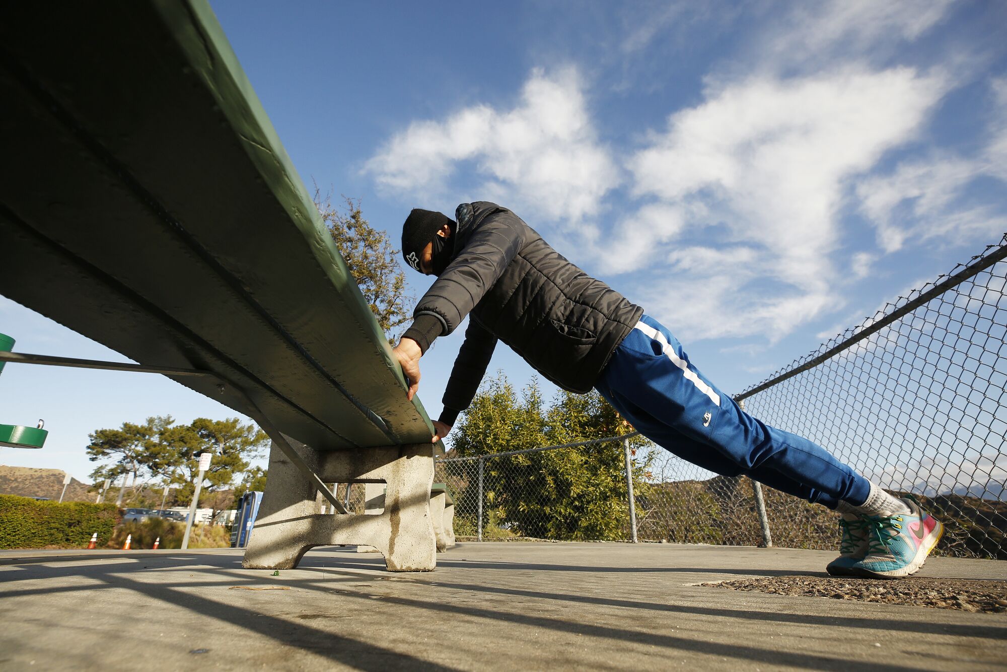 Nico Nava, 33, exercises at Griffith Observatory.