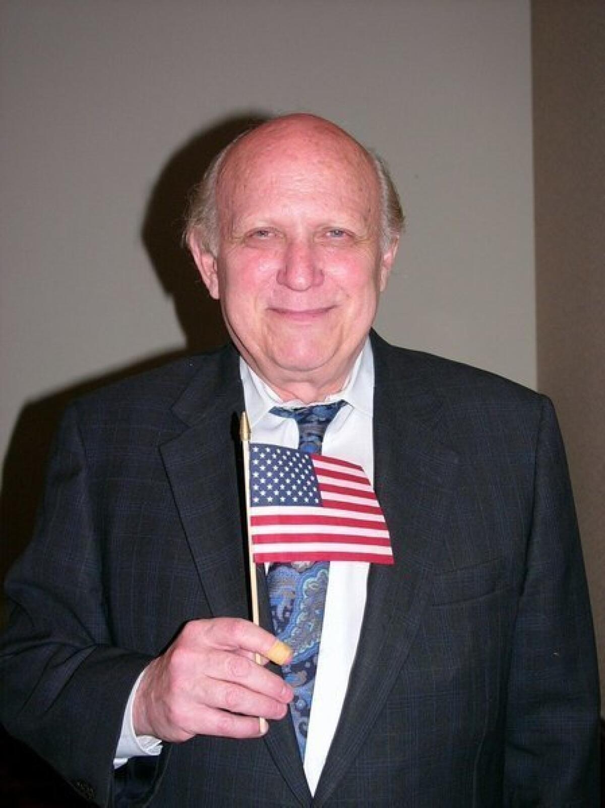 Renowned First Amendment attorney Floyd Abrams shows the flag at a Jewish Museum dinner in New York