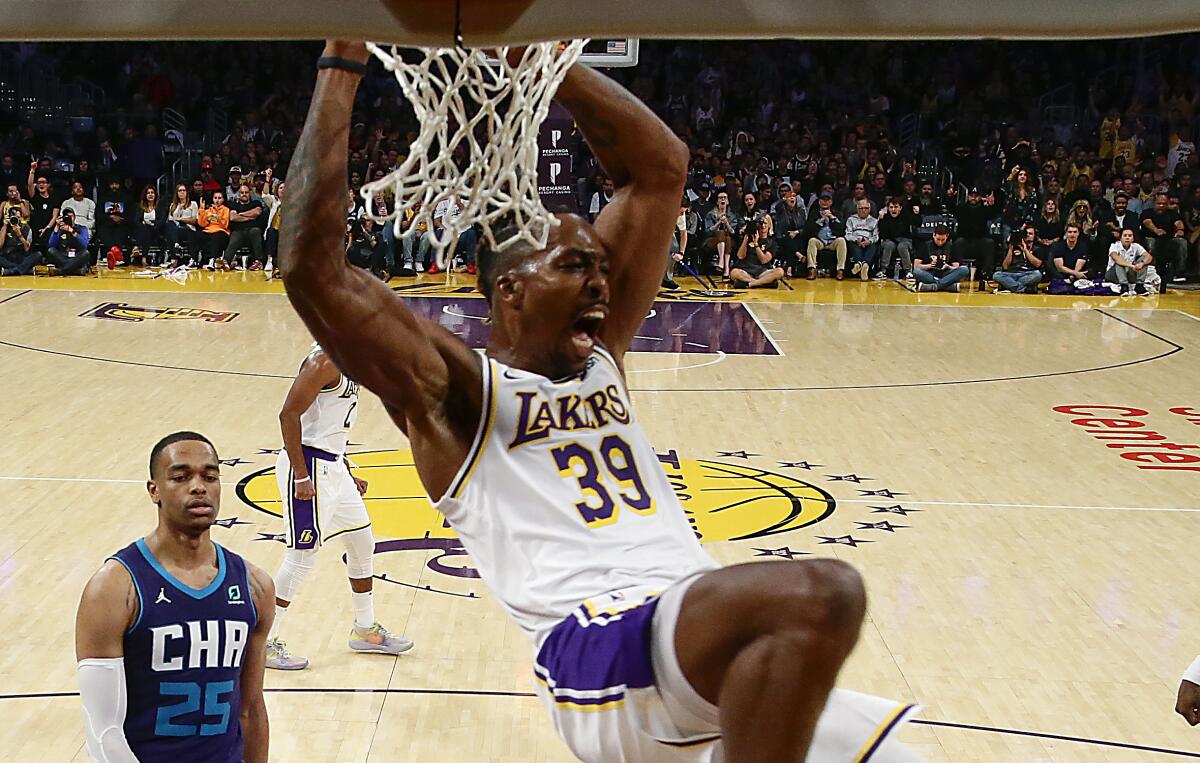 Lakers center Dwight Howard slam dunks during the second half of a 120-101 victory over the Charlotte Hornets at Staples Center on Oct. 27, 2019.