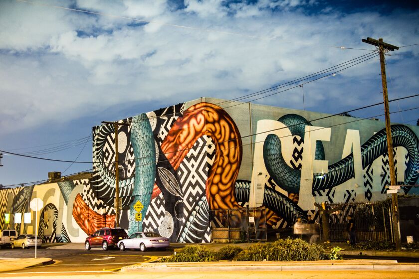 The exterior of Bedrock.LA with a mural by artist Cyrcle.