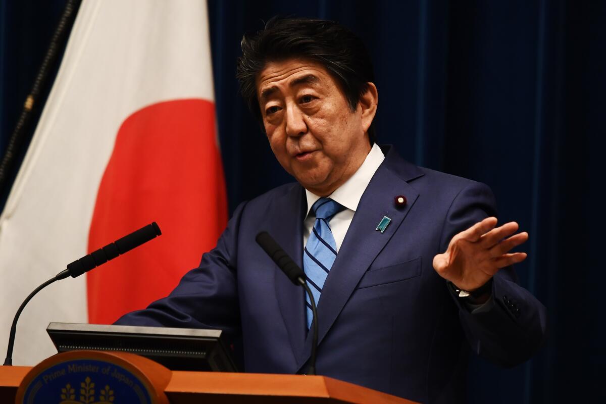 Japanese Prime Minister Shinzo Abe speaks to reporters during a news conference in Tokyo.