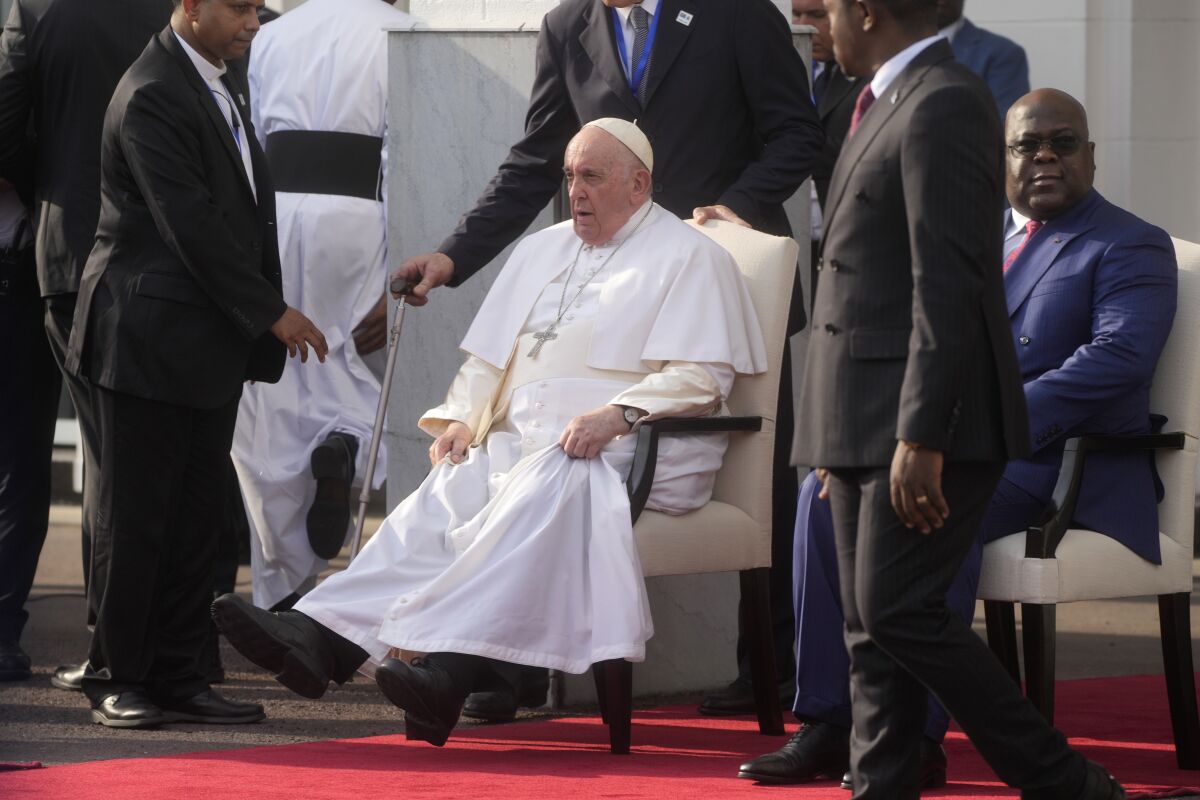 Pope Francis, left, sits with President of the Democratic Republic of the Congo Felix-Antoine Tshisekedi Tshilombo during a welcome ceremony at the "Palais de la Nation" in Kinshasa, Democratic Republic of the Congo, Tuesday, Jan. 31, 2023. Pope Francis starts his six-day pastoral visit to Congo and South Sudan where he'll bring a message of peace to countries riven by poverty and conflict. (AP Photo/Gregorio Borgia)