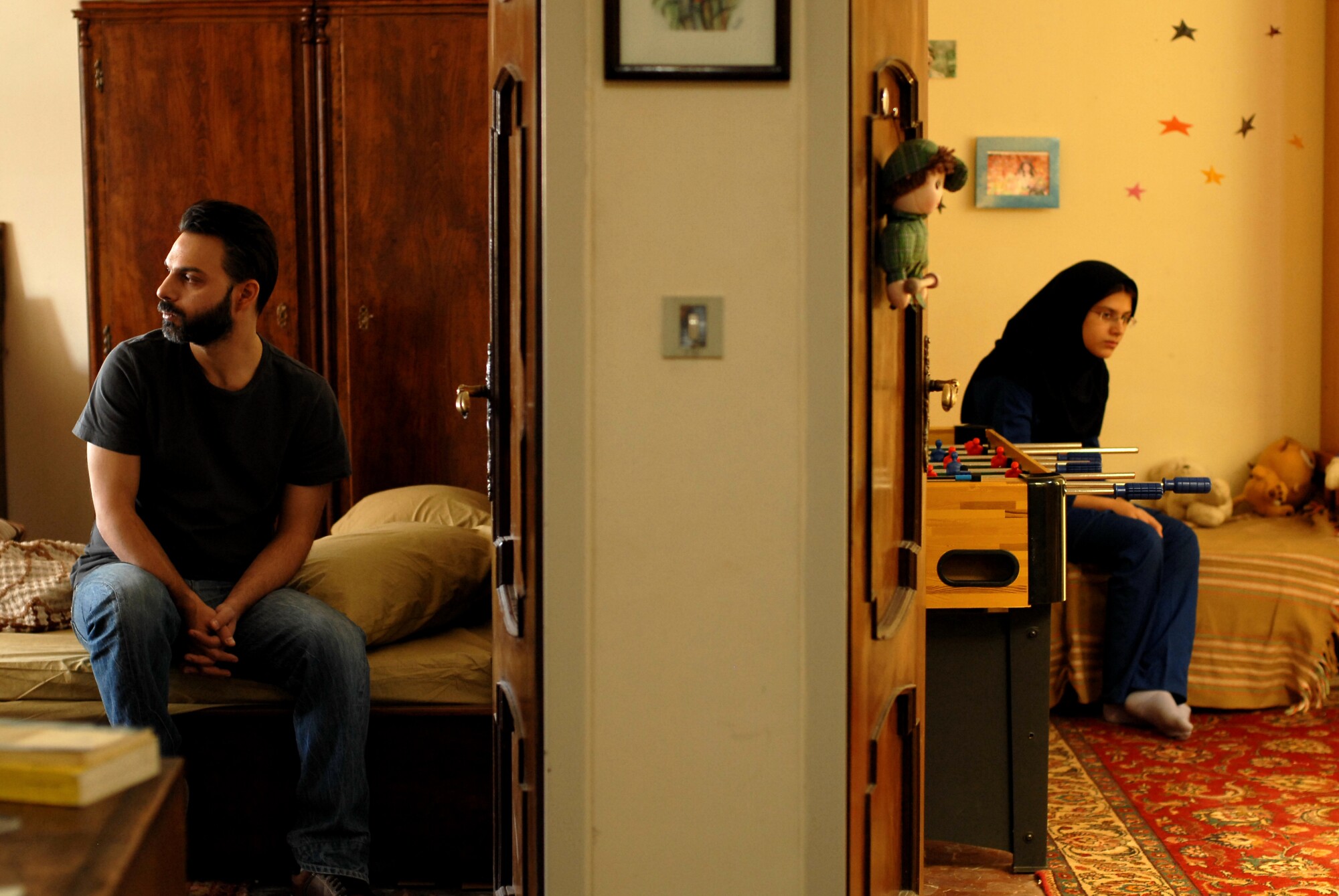 A scene from Asghar Farhadi's "A Separation," with Peyman Moadi, left, and Sarina Farhadi, the director's daughter. 